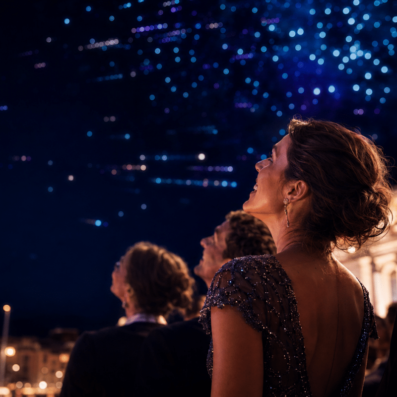 Drone light show people watching